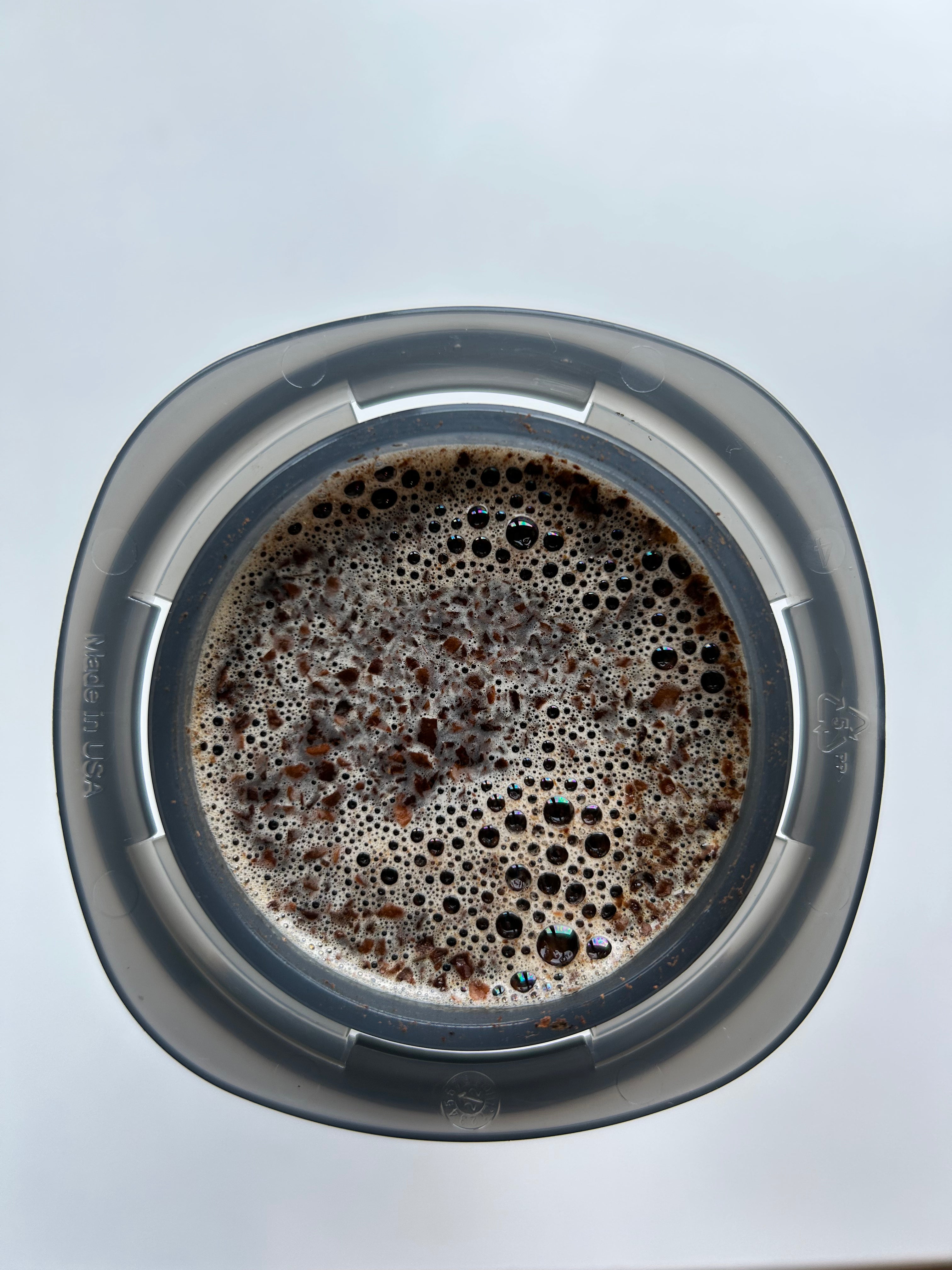 Top view of Aeropress filled with coffee.