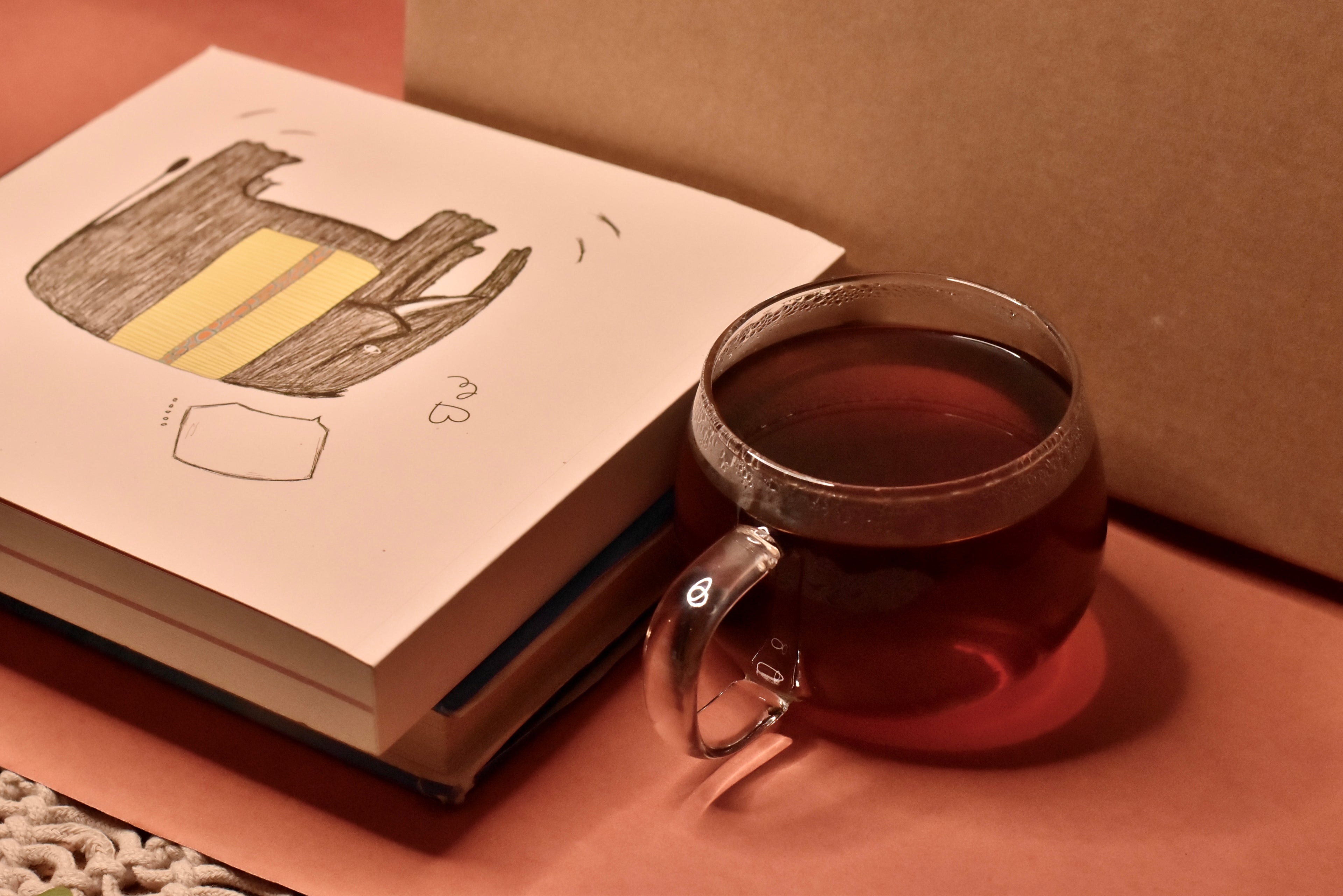 book with coffee kept on table. 
